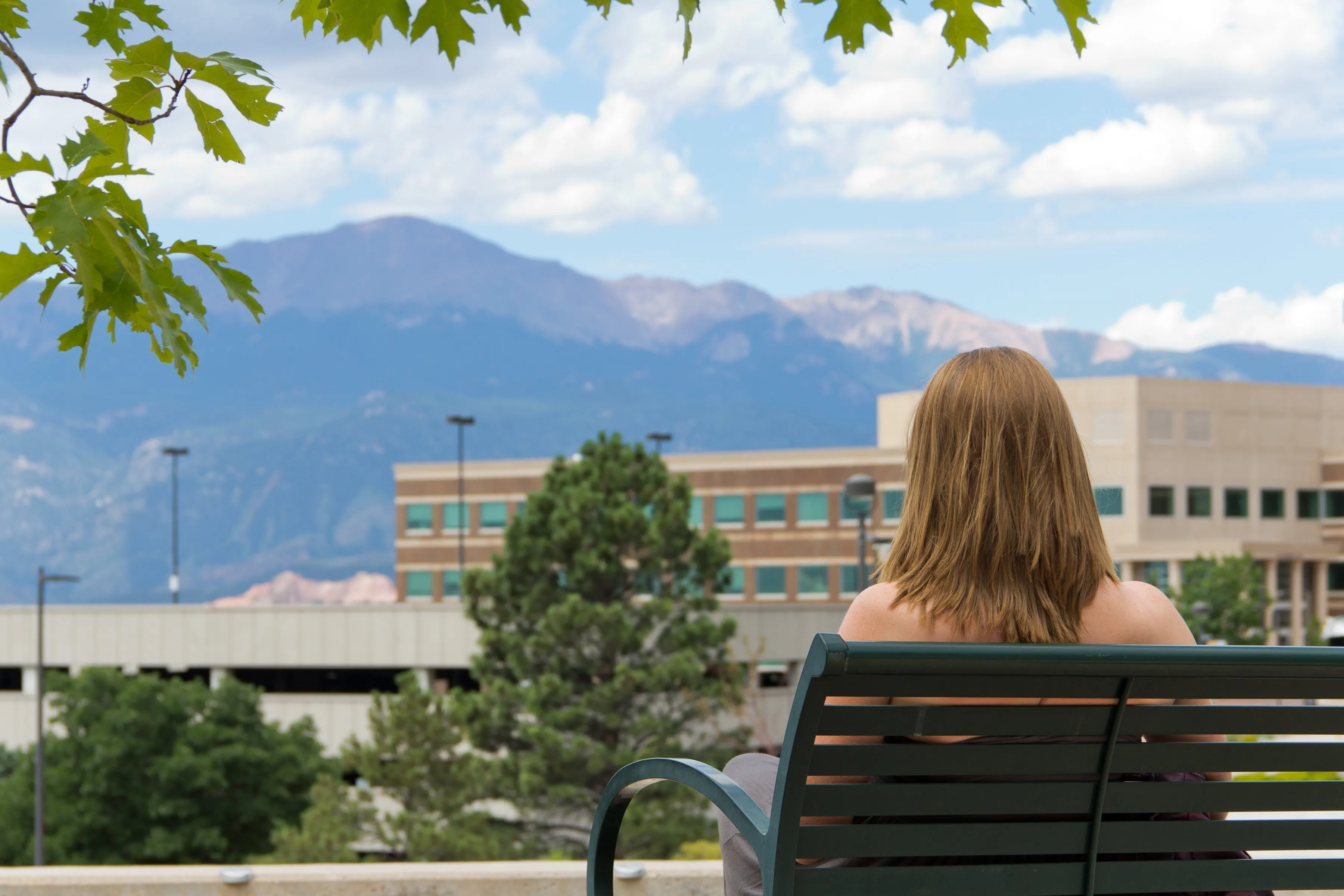 Student looking over to the parking garage
