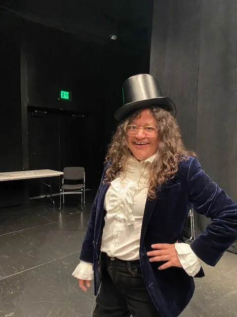 person wearing a top hat at the storytelling contest