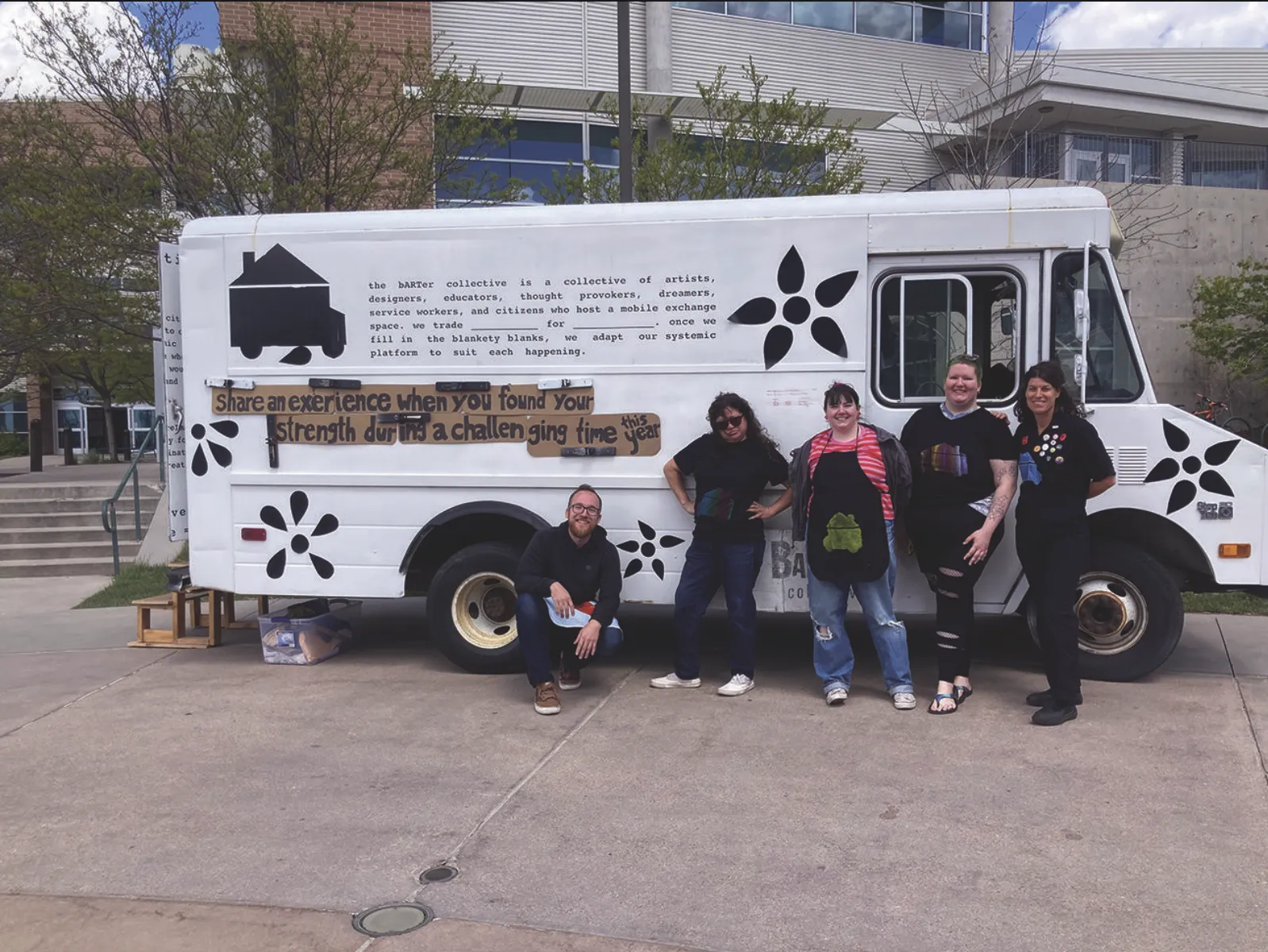 People posing in front of the Barter Truck